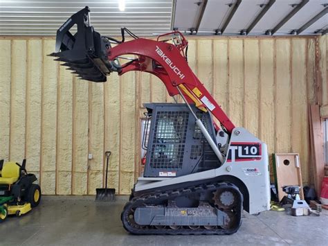 takeuchi skid steer bucket release|skid steer bucket attachment.